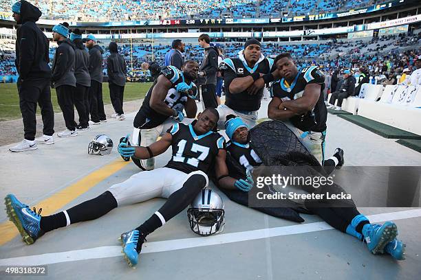 Teammates Jerricho Cotchery, Devin Funchess, Ted Ginn, Jonathan Stewart and Cam Newton of the Carolina Panthers celebrate after defeating the...