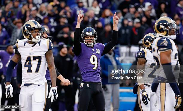 Kicker Justin Tucker of the Baltimore Ravens celebrates after hitting the game winning kick to give the Ravens a 16-13 win over the St. Louis Rams at...