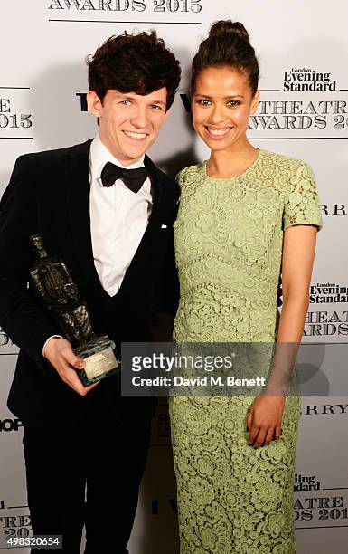 David Moorst, winner of the Emerging Talent Award in partnership with Burberry, poses with presenter Gugu Mbatha-Raw in front of the Winners Boards...