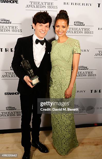 David Moorst, winner of the Emerging Talent Award in partnership with Burberry, poses with presenter Gugu Mbatha-Raw in front of the Winners Boards...