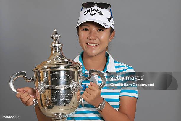 Lydia Ko of New Zealand poses with the Rolex Player of the Year trophy during the final round of the CME Group Tour Championship at Tiburon Golf Club...