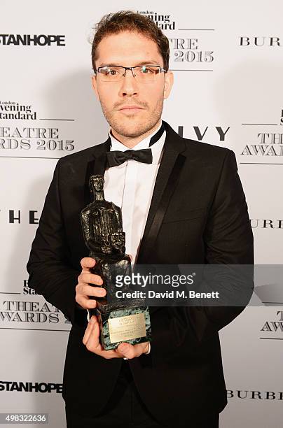 Robert Icke, winner of Best Director for "Oresteia", poses in front of the Winners Boards at The London Evening Standard Theatre Awards in...