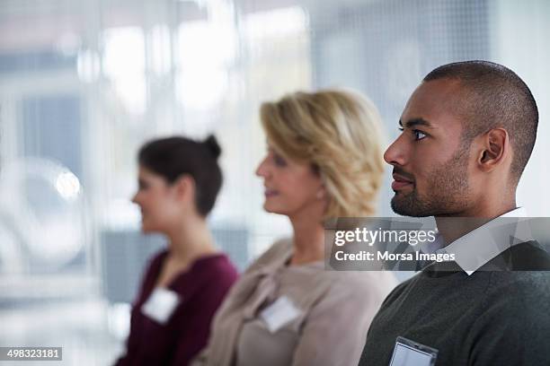business executives in seminar - name plate stock pictures, royalty-free photos & images