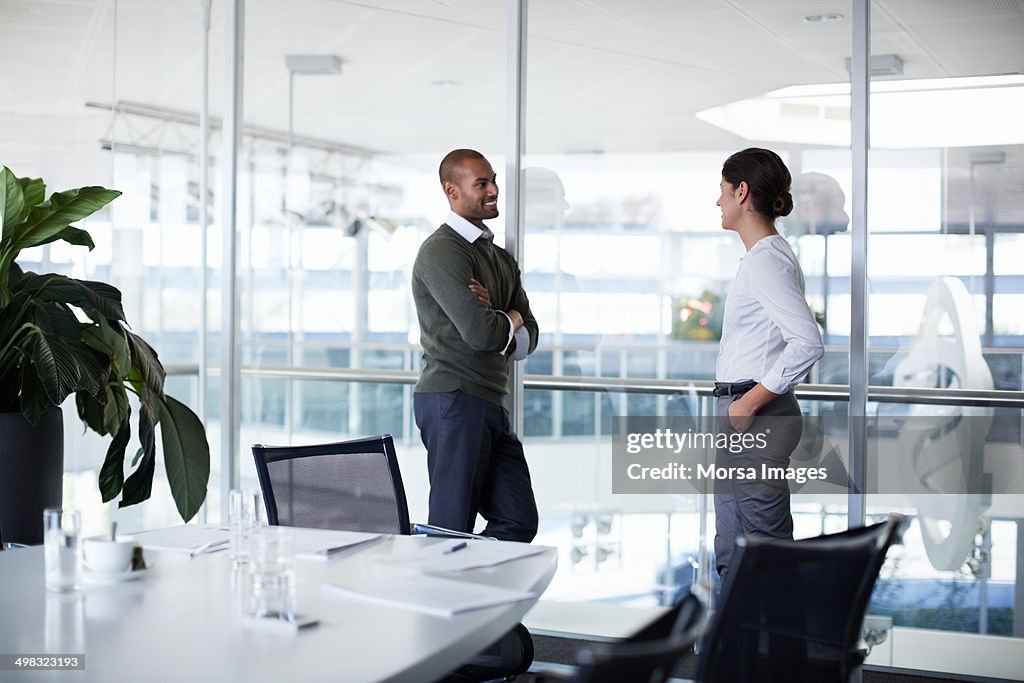 Confident businesspeople discussing