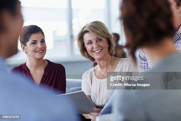 happy businesswoman in meeting - mise au point sélective photos et images de collection