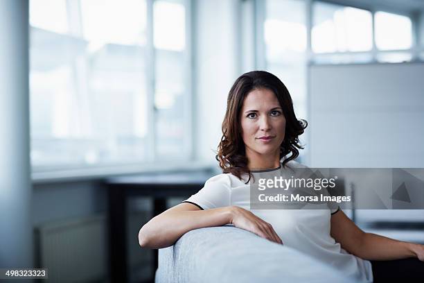 portrait of confident businesswoman - mature brunette woman stockfoto's en -beelden
