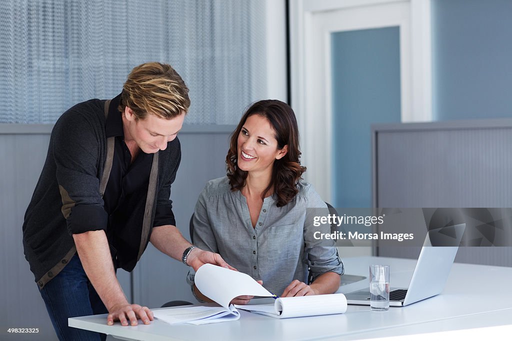 Businesswoman working with male colleague