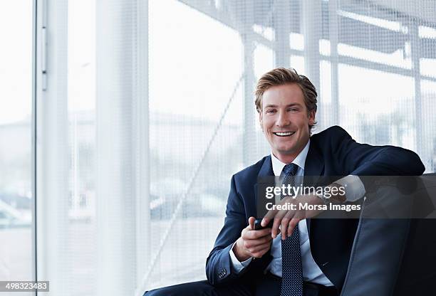 portrait of happy businessman in office - man blonde hair stock pictures, royalty-free photos & images