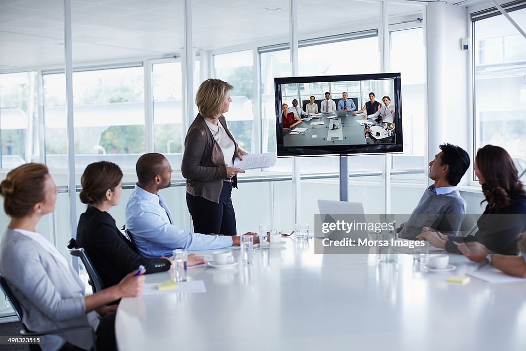 Businesspeople looking at screen