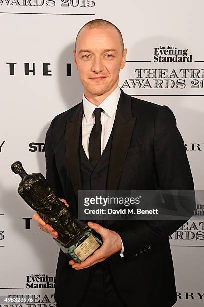 James McAvoy, winner of Best Actor for "The Ruling Class", poses in front of the Winners Boards at The London Evening Standard Theatre Awards in...