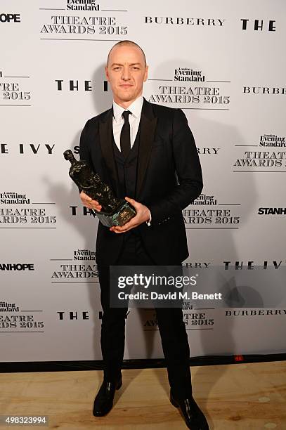 James McAvoy, winner of Best Actor for "The Ruling Class", poses in front of the Winners Boards at The London Evening Standard Theatre Awards in...