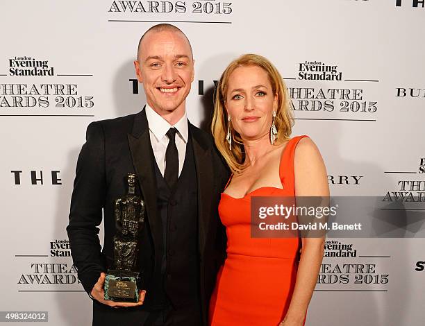 James McAvoy, winner of Best Actor for "The Ruling Class", and Gillian Anderson pose in front of the Winners Boards at The London Evening Standard...