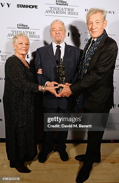 Dame Judi Dench, Stephen Sondheim, winner of the Lebedev Award, and Sir Ian McKellen pose in front of the Winners Boards at The London Evening...