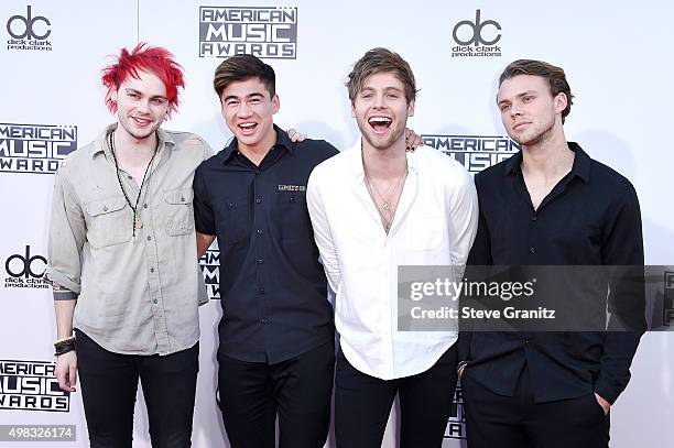 Musicians Michael Clifford, Calum Hood, Luke Hemmings and Ashton Irwin of 5 Seconds of Summer attend the 2015 American Music Awards at Microsoft...
