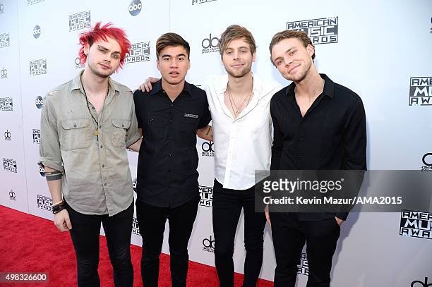 Musicians Michael Clifford, Calum Hood, Luke Hemmings and Ashton Irwin of 5 Seconds of Summer attend the 2015 American Music Awards at Microsoft...