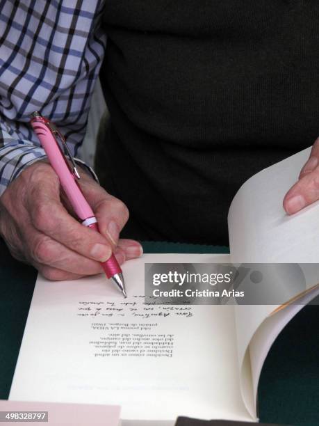Detail of the hand of the poet Marcos Ana while writing a dedication in a copy of one of his books at Book Fair 2013 in the Retiro Park in Madrid,...