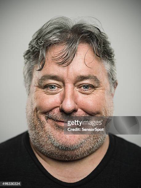 portrait of a real happy english man looking at camera. - chubby face stockfoto's en -beelden