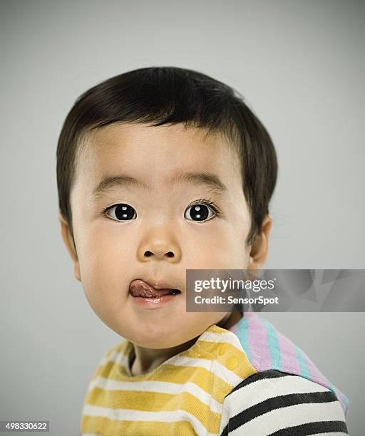 portrait of a japanese baby looking at camera - funny baby faces stock pictures, royalty-free photos & images