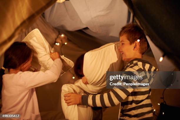 pillow war! - duvet inners stock pictures, royalty-free photos & images