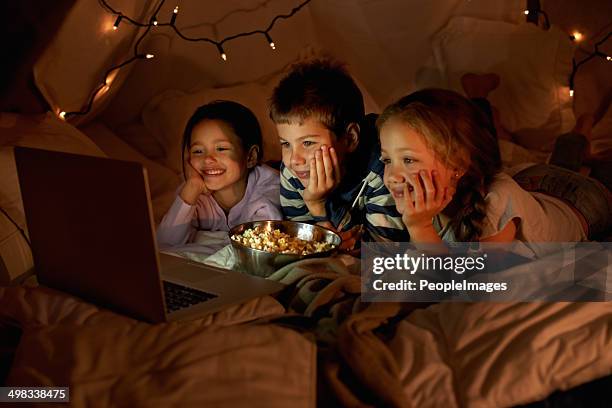 movie time in the blanket fort - pajamas stockfoto's en -beelden