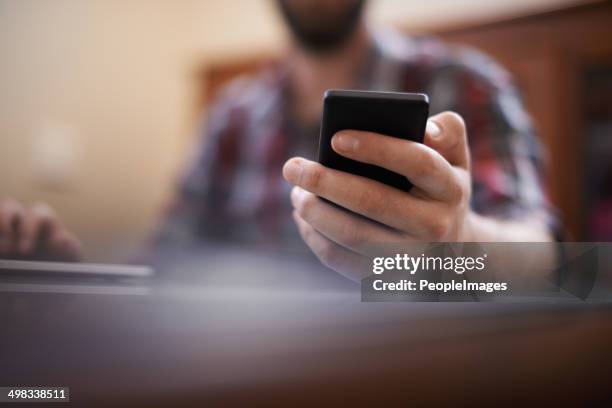 he's connected in more ways than one - hands texting stock pictures, royalty-free photos & images