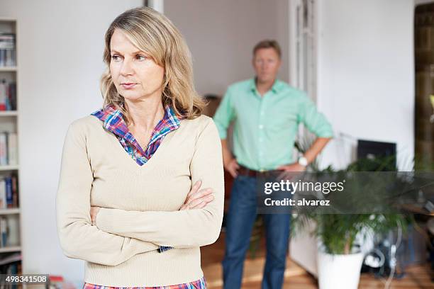 mature couple experiences marital problems - angry wife stock pictures, royalty-free photos & images