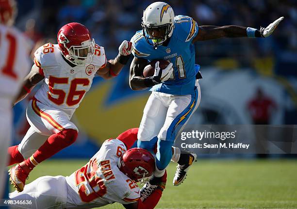 Steve Johnson of the San Diego Chargers runs with the ball turnover avoid the tackle of Eric Berry of the Kansas City Chiefs and Derrick Johnson of...