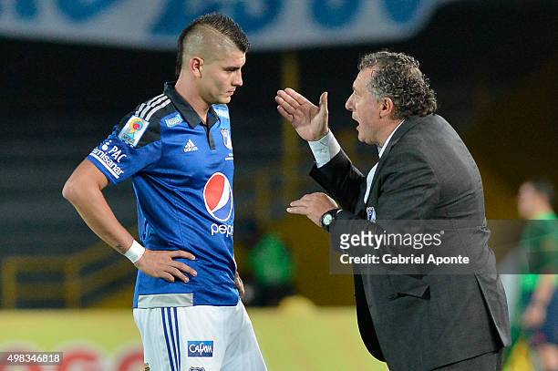 Ruben Israel coach of Millonarios gives directions to his player Michael Rangel during a match between Millonarios and Independiente Santa Fe as part...