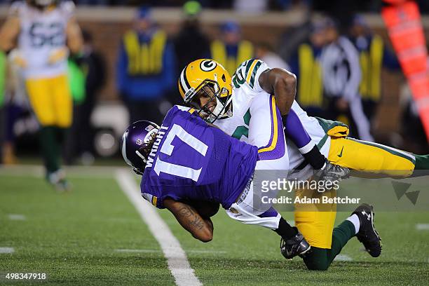 Jarius Wright of the Minnesota Vikings gets tackled by Casey Hayward of the Green Bay Packers in the fourth quarter on November 22, 2015 at TCF Bank...