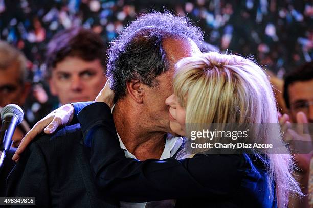 Daniel Scioli Presidential Candidate for Frente Para La Victoria is kissed by his wife Karina Rabolini gives a speech after runoff elections at...