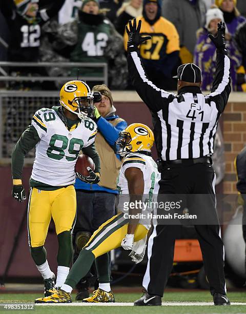 Randall Cobb of the Green Bay Packers congratulates teammate James Jones on touchdown against the Minnesota Vikings during the fourth quarter of the...