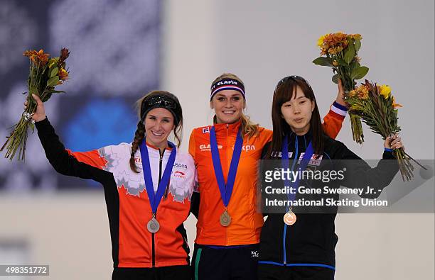 Second place Ivanie Blodin of Canada, first place Irene Schouten of the Netherlands and third place Misaki Oshigiri of Japan on the podium after the...