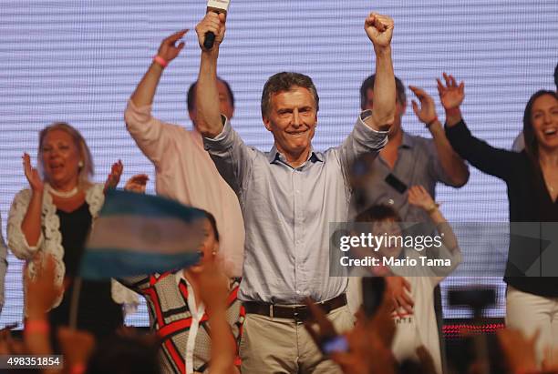 Opposition presidential candidate Mauricio Macri celebrates after defeating ruling party candidate Daniel Scioli in a runoff election on November 22,...