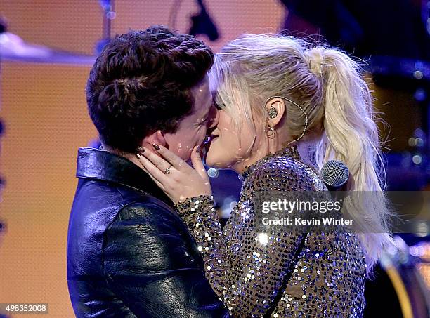 Singers Charlie Puth and Meghan Trainor kiss onstage during the 2015 American Music Awards at Microsoft Theater on November 22, 2015 in Los Angeles,...