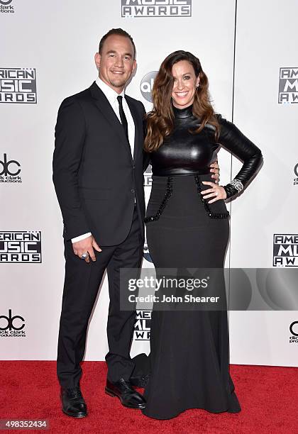 Recording artist Alanis Morissette and musician Mario Treadway attend the 2015 American Music Awards at Microsoft Theater on November 22, 2015 in Los...