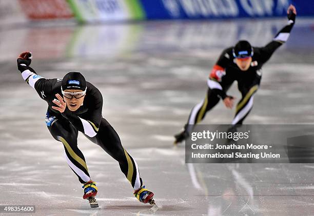 Joji Kato competes against Ryohei Haga in the Men's 500m race during the race on day three of the ISU World Cup Speed Skating Salt Lake City Event at...