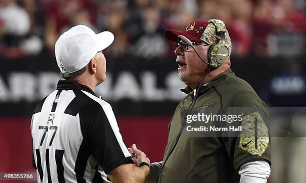 Head coach Bruce Arians of the Arizona Cardinals talks with referee Terry McAulay during the NFL game against the Cincinnati Bengals at University of...