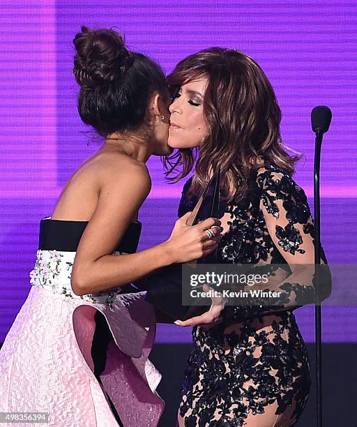 Singer Ariana Grande accepts Favorite Pop/Rock Female Artist award from TV personality Paula Abdul onstage during the 2015 American Music Awards at...