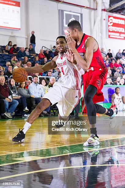 Coty Clarke of the Maine Red Claws drives against Bruna Caboclo of the Toronto Raptors 905 on November 22, 2015 at the Portland Expo in Portland,...