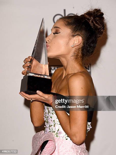 Recording artist Ariana Grande, winner of Favorite Pop/Rock Female Artist, poses in the press room during the 2015 American Music Awards at Microsoft...