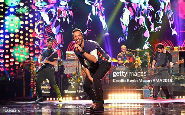 Recording artists Jonny Buckland, Chris Martin, Will Champion and Guy Berryman of music group Coldplay perform onstage during the 2015 American Music...