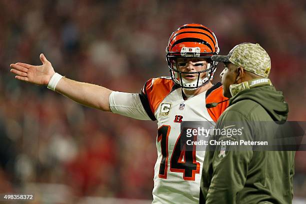 Quarterback Andy Dalton of the Cincinnati Bengals talks with head coach Marvin Lewis during the first half of the NFL game against the Arizona...