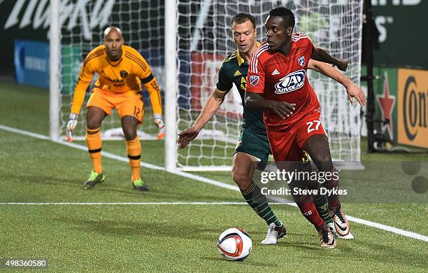 Jack Jewsbury of Portland Timbers defends Je-Vaughn Watson of FC Dallas as goal keeper Adam Kwarasey of Portland Timbers during the second half of...