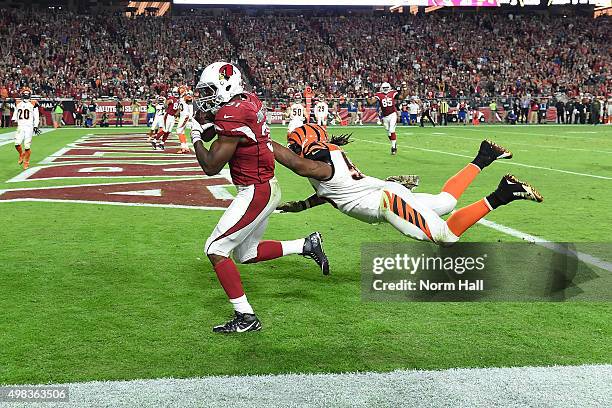 Running back David Johnson of the Arizona Cardinals runs past linebacker Vontaze Burfict of the Cincinnati Bengals for a touchdown during the third...