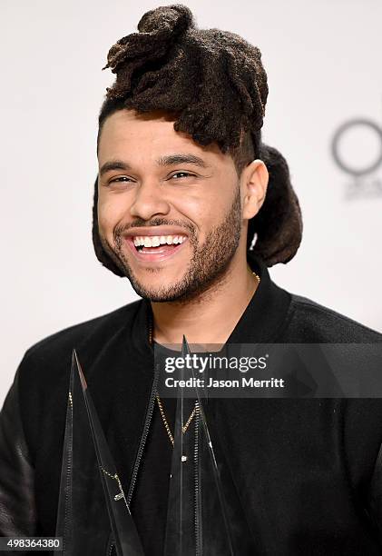 Recording artist The Weeknd, winner of Favorite Soul/R&B Male Artist and Favorite Soul/R&B Album, poses in the press room during the 2015 American...