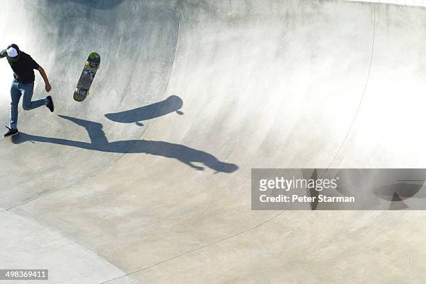 skate boarder falling off skate baord. - all that skate 2014 stock pictures, royalty-free photos & images