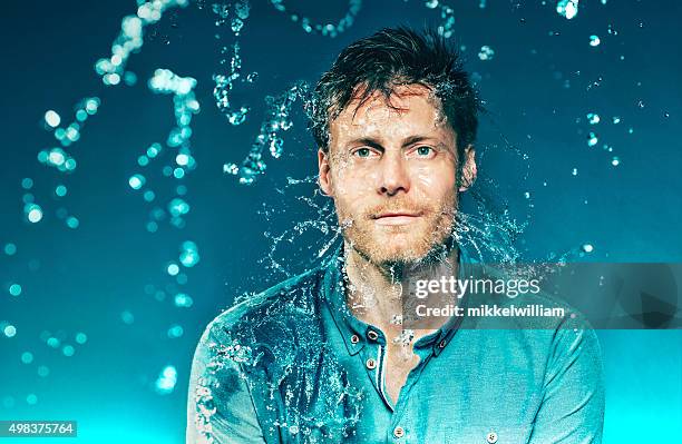 eyes wide open as man water in his head - slow motion water stock pictures, royalty-free photos & images