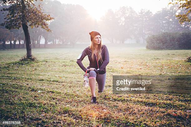 stretching before jogging - mass unit of measurement stock pictures, royalty-free photos & images