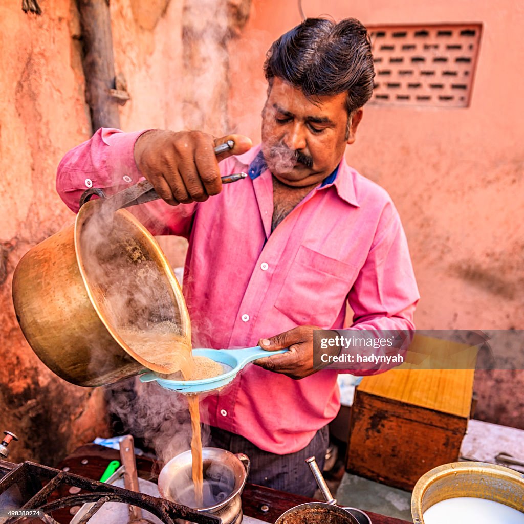 Indian street seller selling tea - masala chai in Jaipur