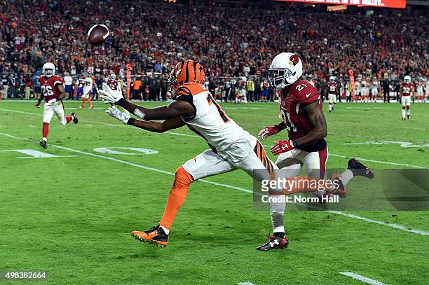 Wide receiver AJ Green of the Cincinnati Bengals hauls in a pass while being defended by cornerback Patrick Peterson of the Arizona Cardinals during...